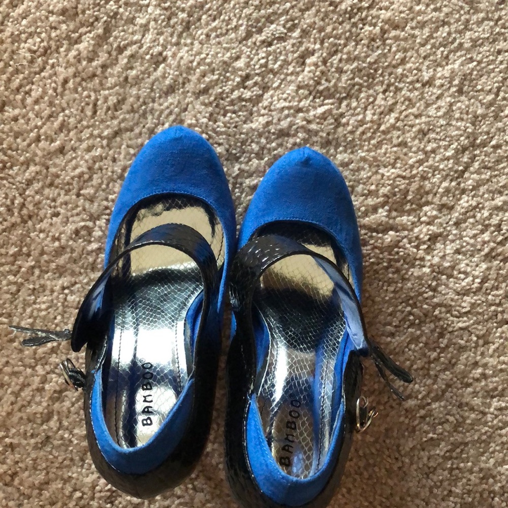 Royal blue almond toe pumps with black strap.